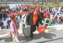 Free trains and buses carry migrants back to work