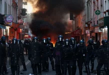 Tensions flare again in Paris as France counts cost of worst unrest in years